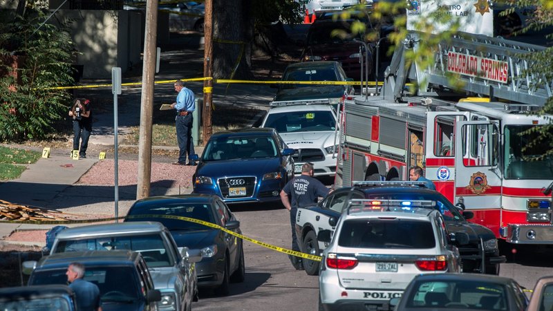 Police investigate the scene after a shooting Saturday, Oct. 31, 2015, in Colorado Springs, Colo. Multiple are dead, including a suspected gunman, following a shooting spree according to authorities. Lt. Catherine Buckley said the crime scene covers several major downtown streets. (Christian Murdock/The Gazette via AP) MAGS OUT; MANDATORY CREDIT