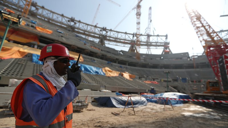 epa08083067 Construction workers at Lusail  Stadium during a media tour in Doha, Qatar, 20 December 2019. Lusail Stadium is one of the eight stadiums build for the FIFA World Cup 2022 in Qatar.  EPA-EFE/ALI HAIDER